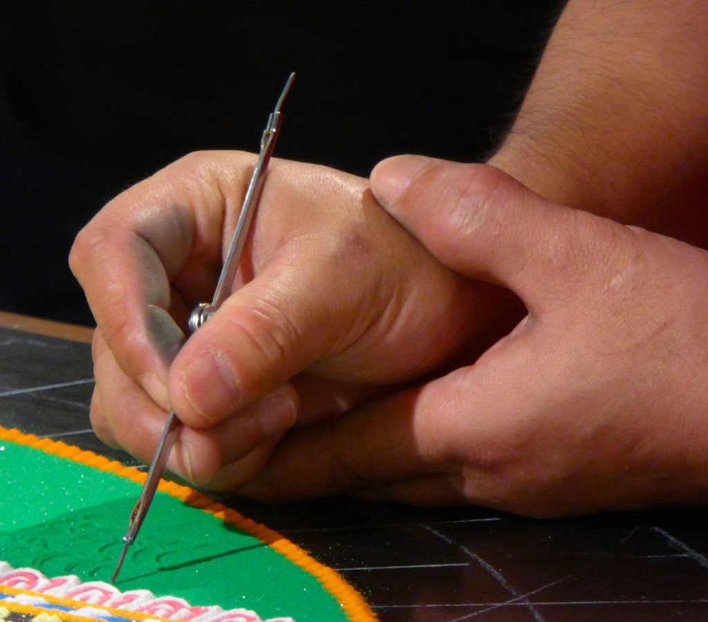 Tibetan monks continue to create sand mandala for our community.