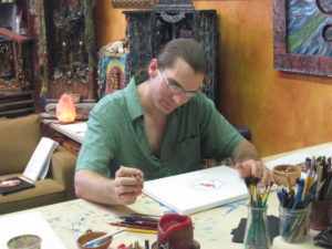 In dialog with what is being created. Having no expectations but trusting the creative process.