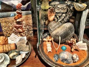 Sharing with you a closer look of my Kitchen Altar. Here is a closer look into my altar. That' s my son-in-laws hand stacking stones while we were in Montana hiking in Glacier National Park. See the heart shaped rock? Nestled behind it is a wooden heart that has lots of milagros nailed to it. These are found throughout Mexico and each one has a different "personality."