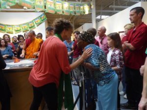 Sand mandala offers community healing. - art as key to survivorship