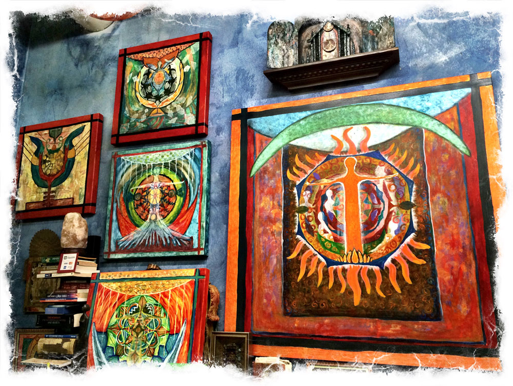 Framed artworks on a textured wall